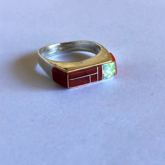 Sterling silver ring with coral and opal inlay.